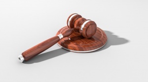 a wood grain gavel with silver accents